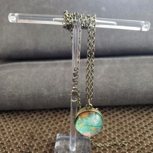Planet Earth glass globe necklace. Antique color.